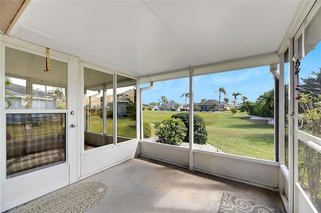 719 Winterbrooke Way, Sun City Center, FL 33573 - unfurnished sunroom featuring a residential view