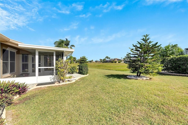 view of yard featuring a sunroom