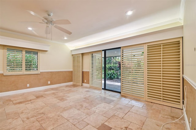 unfurnished room with ornamental molding, a wealth of natural light, and ceiling fan