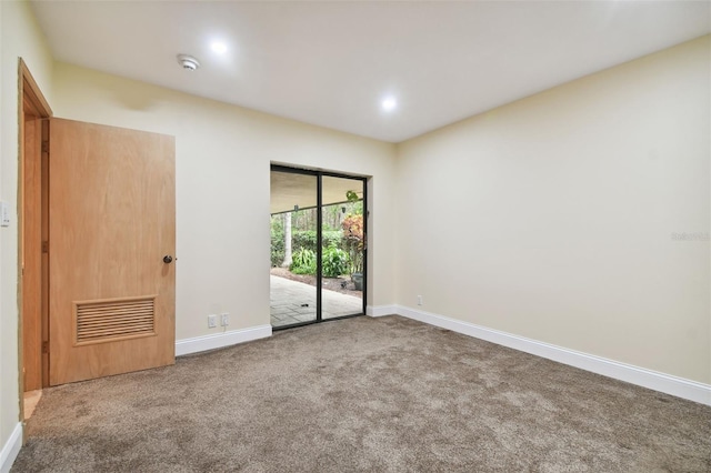 view of carpeted spare room