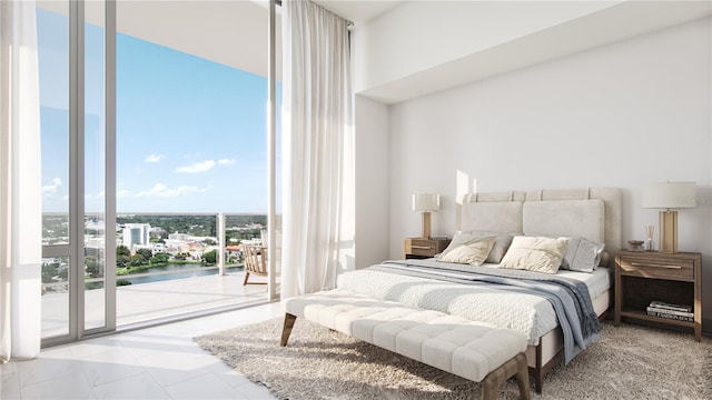 bedroom with a water view, floor to ceiling windows, and access to exterior