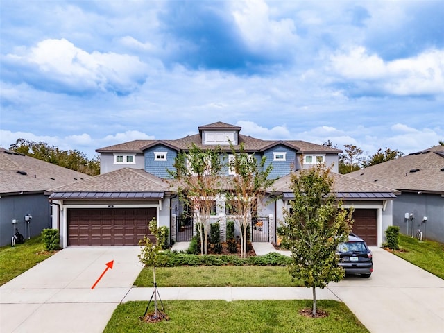 view of front of home with a garage and a front yard