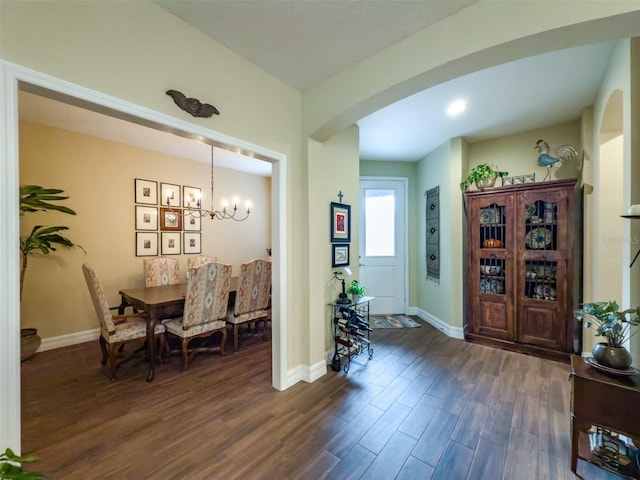 foyer featuring a chandelier and dark hardwood / wood-style floors