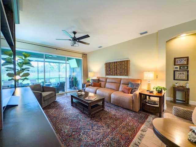 living room with hardwood / wood-style floors and ceiling fan