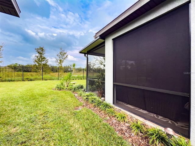 view of yard featuring a sunroom