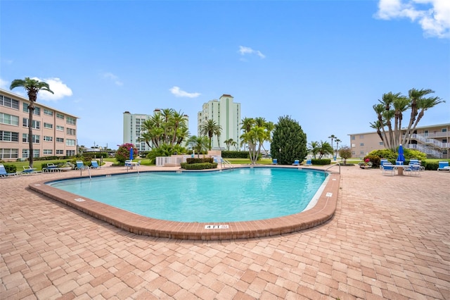 view of pool featuring a patio area