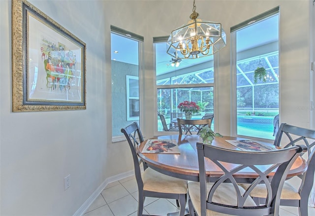 tiled dining area featuring a notable chandelier