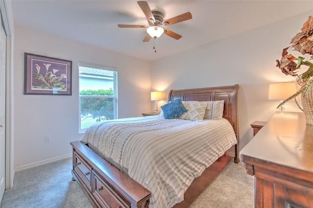 bedroom featuring ceiling fan and light colored carpet