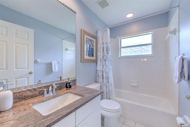 full bathroom with tile patterned floors, vanity, shower / tub combo, and toilet