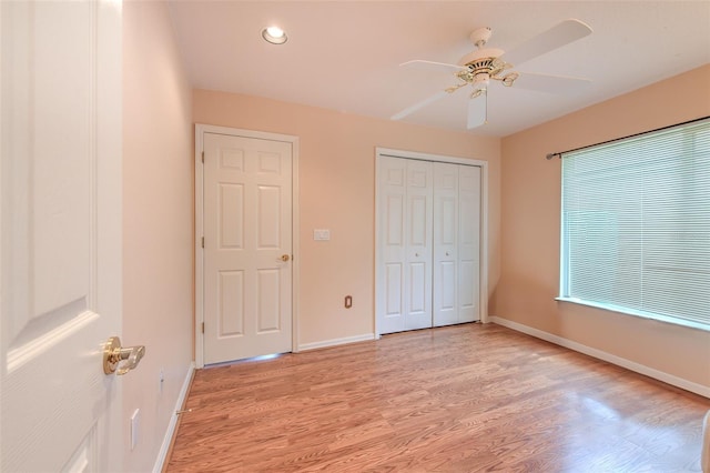 unfurnished bedroom with light hardwood / wood-style flooring and ceiling fan