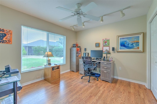 office area with ceiling fan, light wood-type flooring, and rail lighting