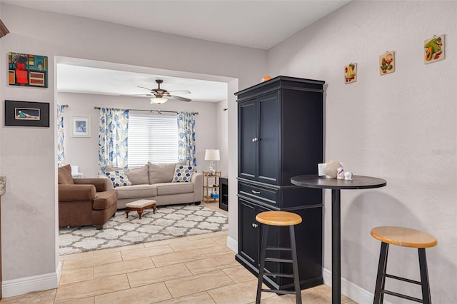 living room with ceiling fan