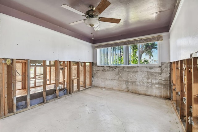 interior space with ceiling fan