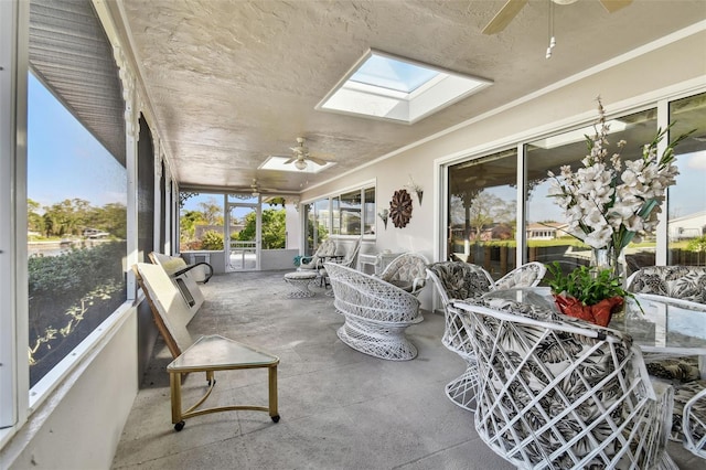 sunroom / solarium with ceiling fan