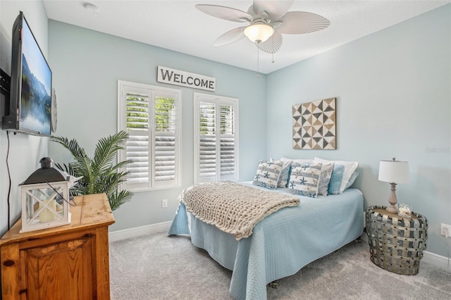 bedroom featuring ceiling fan and light carpet