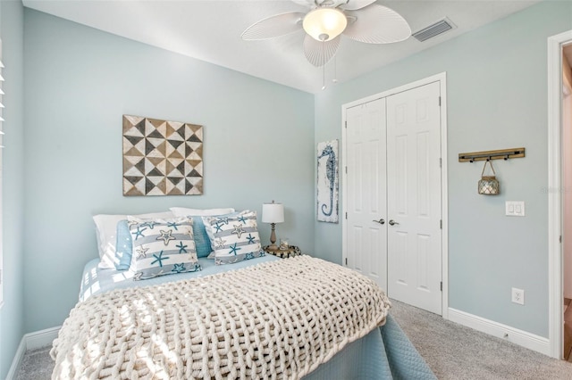 carpeted bedroom with a closet and ceiling fan