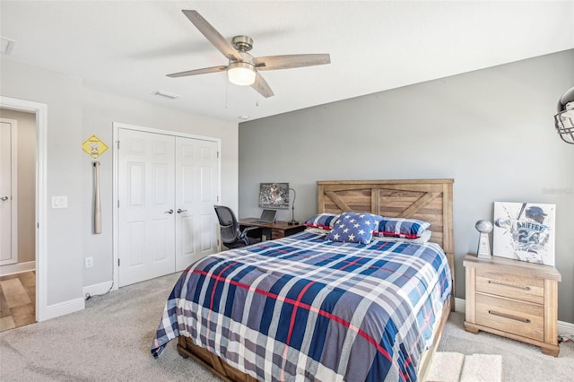 bedroom featuring ceiling fan, a closet, and light carpet