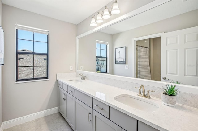 bathroom with vanity and tile patterned flooring