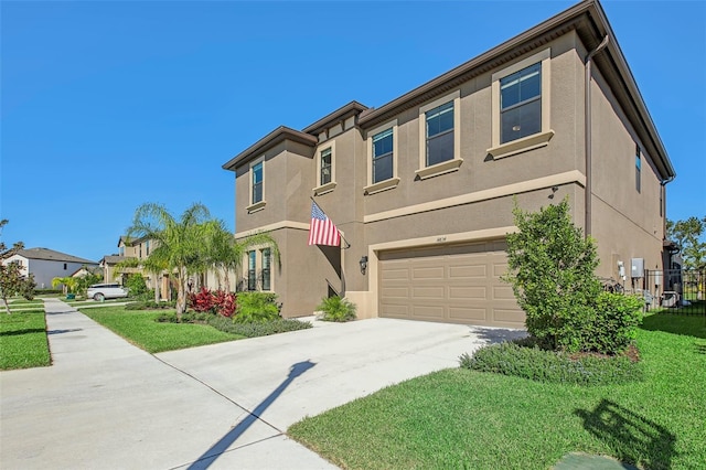 view of front of property with a front lawn and a garage