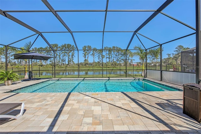 view of pool featuring a lanai, a water view, and a patio