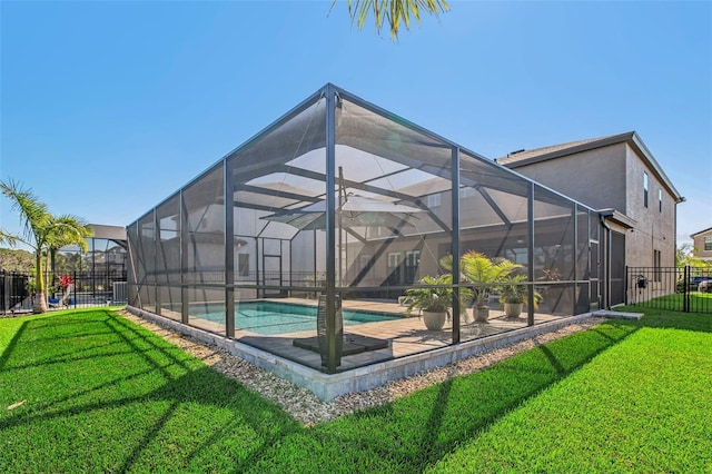 view of swimming pool with a lanai, central AC unit, and a lawn