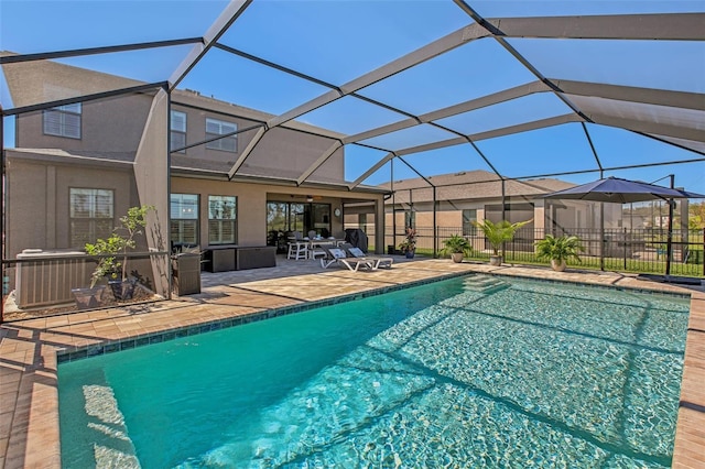 view of pool featuring central AC unit, a patio area, and glass enclosure