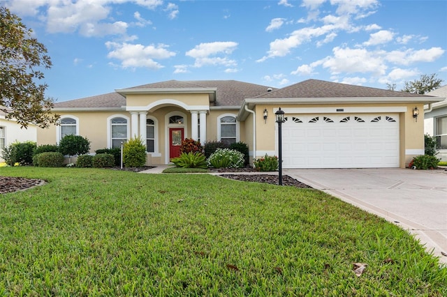 view of front facade featuring a front lawn and a garage