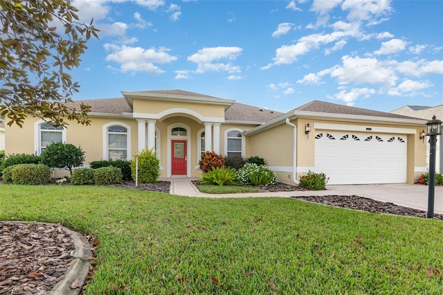 view of front of property featuring a front lawn and a garage