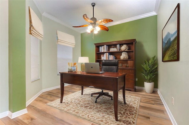 office with light wood-type flooring, ceiling fan, and ornamental molding