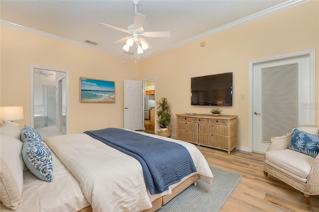 bedroom with light wood-type flooring, ceiling fan, crown molding, and connected bathroom