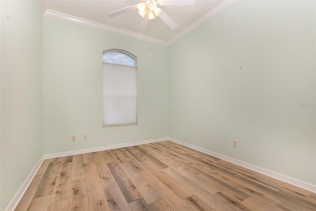 unfurnished room with ornamental molding, light hardwood / wood-style floors, and ceiling fan