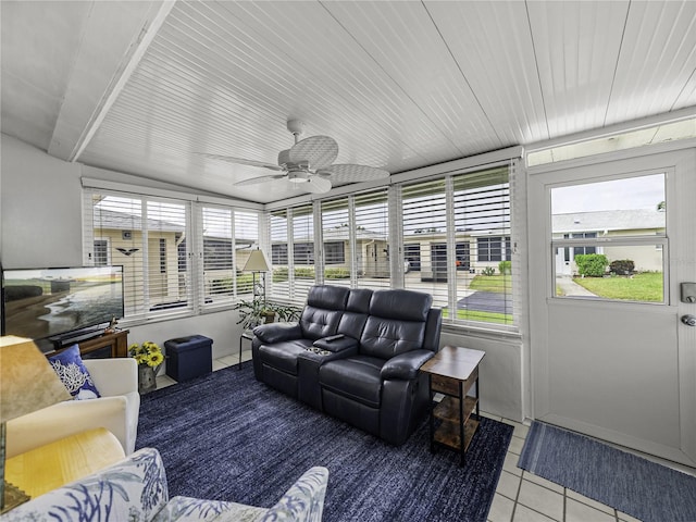 sunroom / solarium with lofted ceiling and ceiling fan