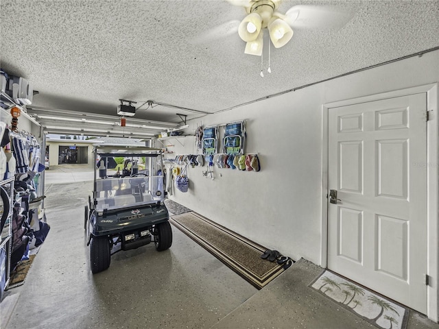 garage featuring ceiling fan and a garage door opener