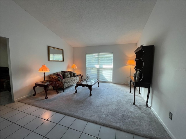 tiled living room with vaulted ceiling and a textured ceiling