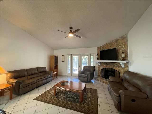 tiled living room with french doors, ceiling fan, a textured ceiling, and vaulted ceiling