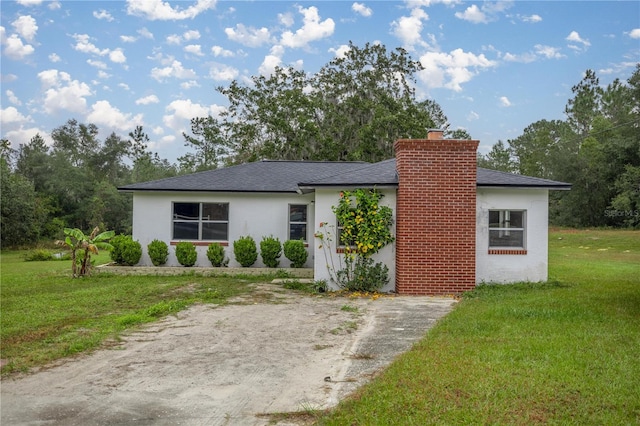 view of front of home with a front lawn