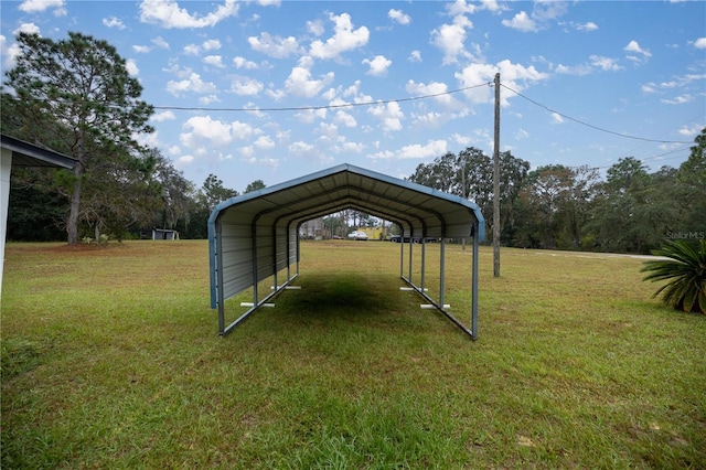 view of outbuilding with a yard and a carport