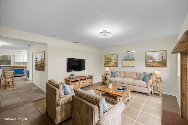 living room with plenty of natural light and light wood-type flooring