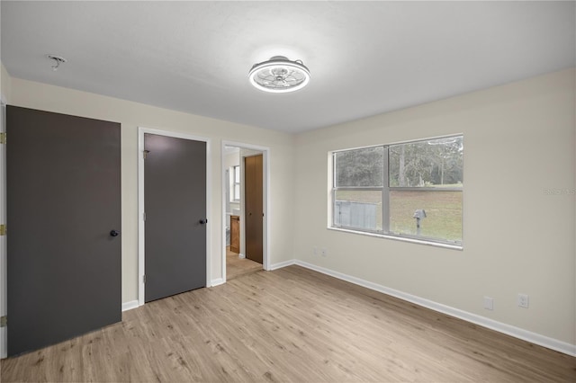 unfurnished bedroom with light hardwood / wood-style flooring