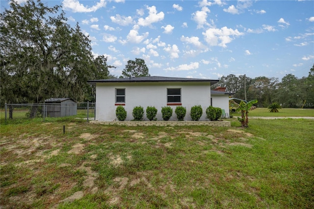 view of home's exterior with a lawn