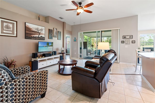 tiled living room featuring ceiling fan