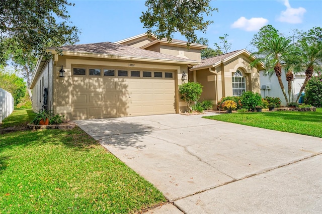 view of front of property featuring a garage and a front yard