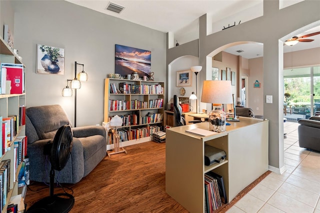 office space featuring ceiling fan and light tile patterned flooring