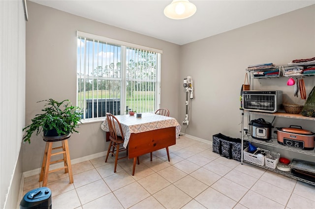 dining area with light tile patterned flooring