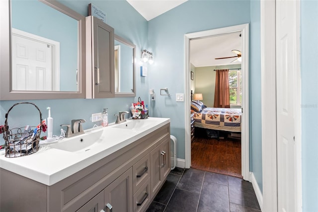 bathroom featuring ceiling fan, tile patterned floors, and vanity