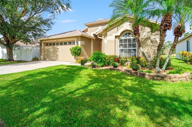 view of front of house featuring a garage and a front lawn