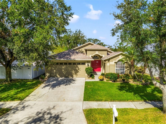 view of front facade with a front lawn and a garage