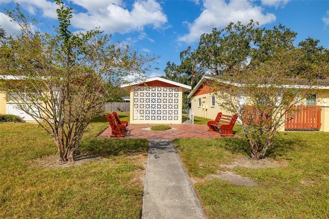 view of home's community with a yard