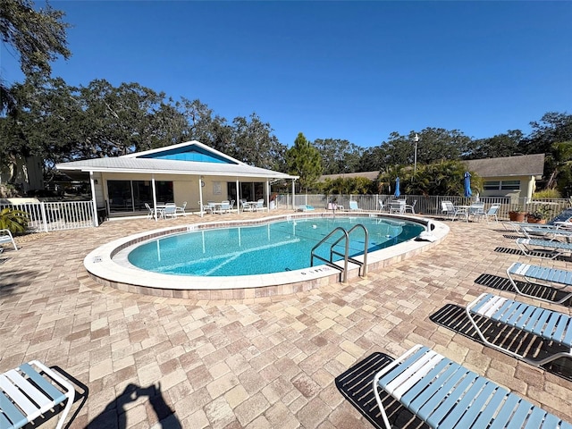 view of swimming pool featuring a patio