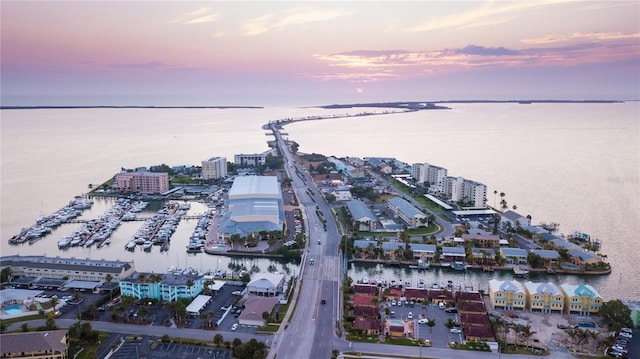 aerial view at dusk with a water view